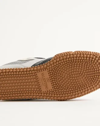 Amphibia-sneaker i gummiert kalveskinn og laminert nappa