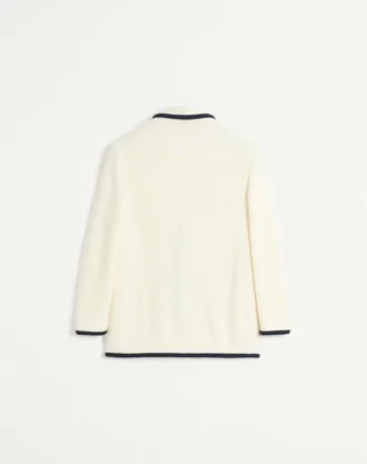 Enkeltradet jakke i ull og bomull med torchon-piping
