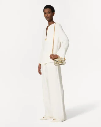 Liten Valentino Garavani Locò skulderveske i metallisk kalveskinn